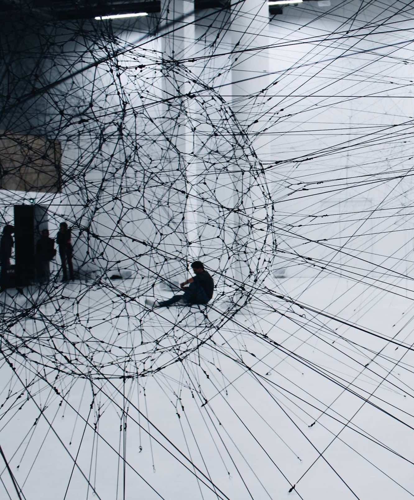 individuals sitting inside a geometric connected data sphere