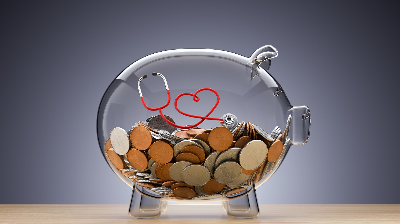 transparent piggy bank filled with coins and stethoscope