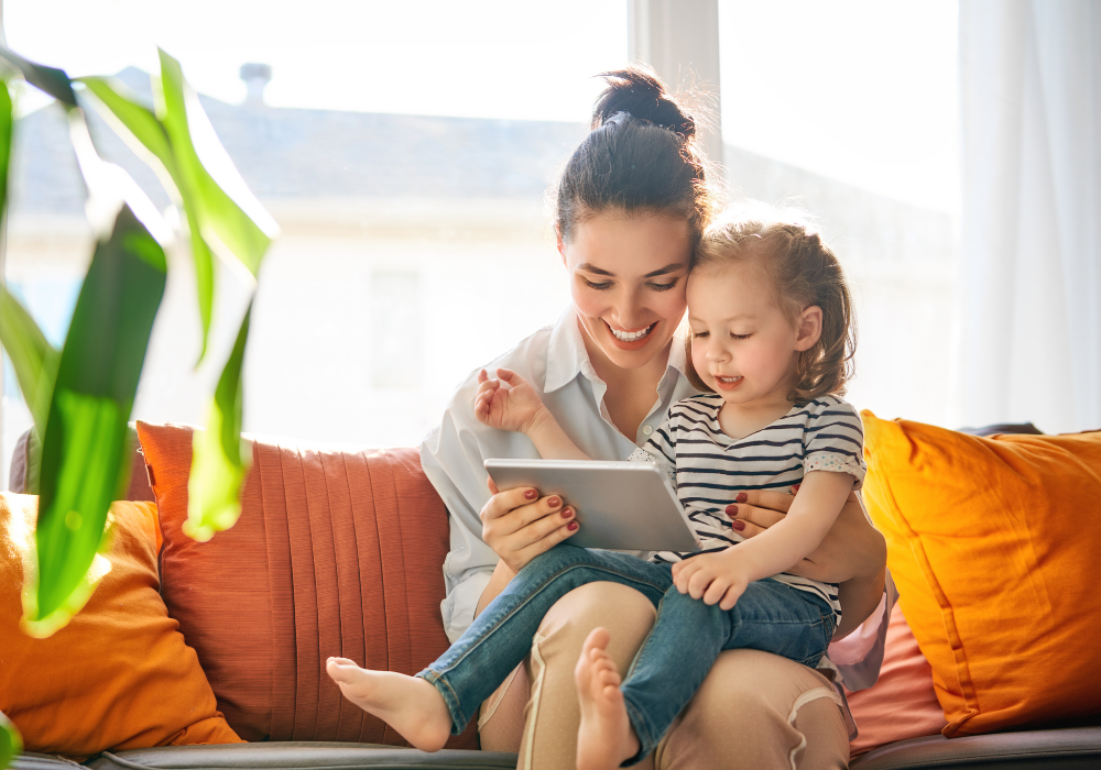 young mother holding yound daughter