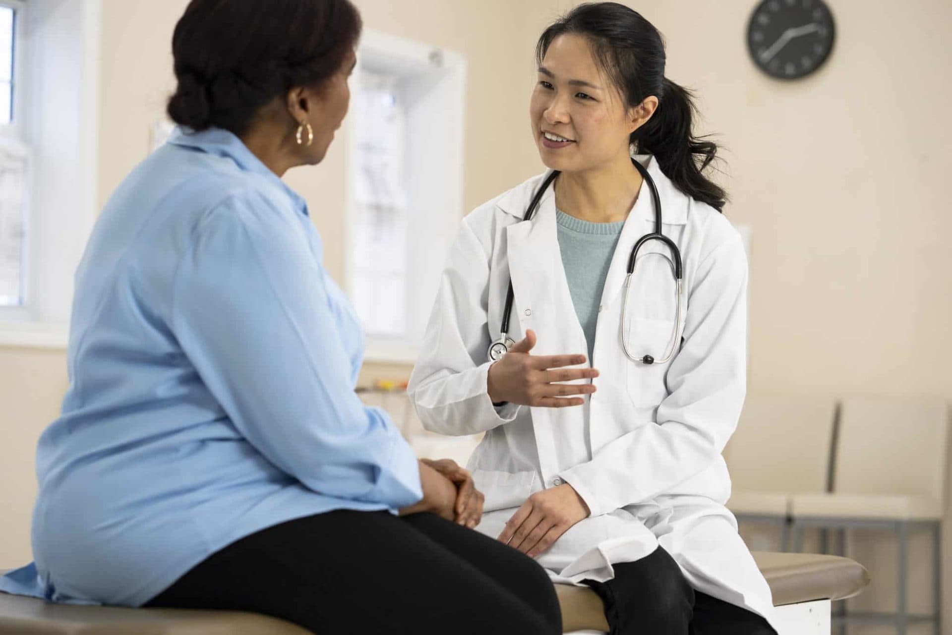A healthcare provider talks with a patient.