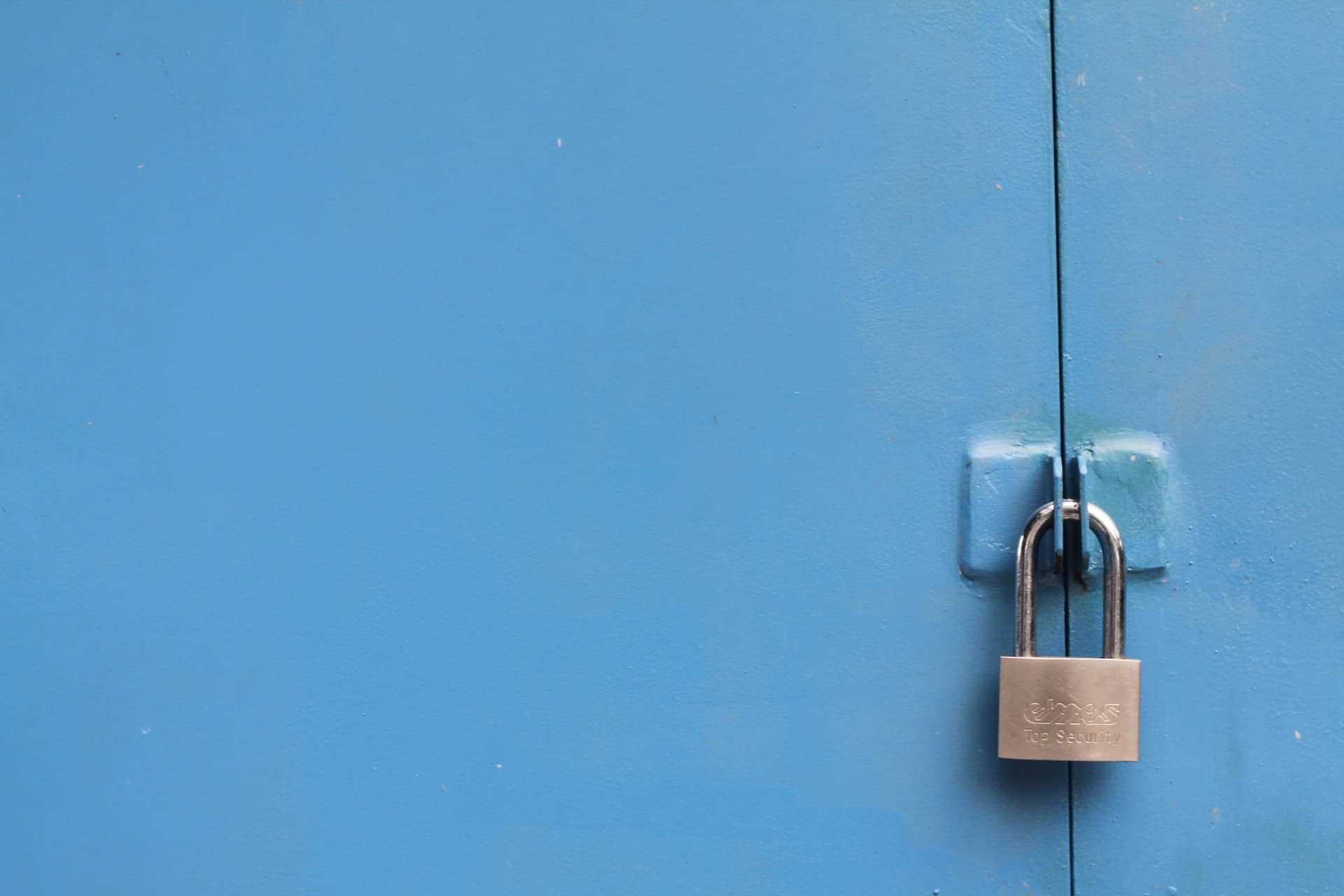 A lock on a door representing security.