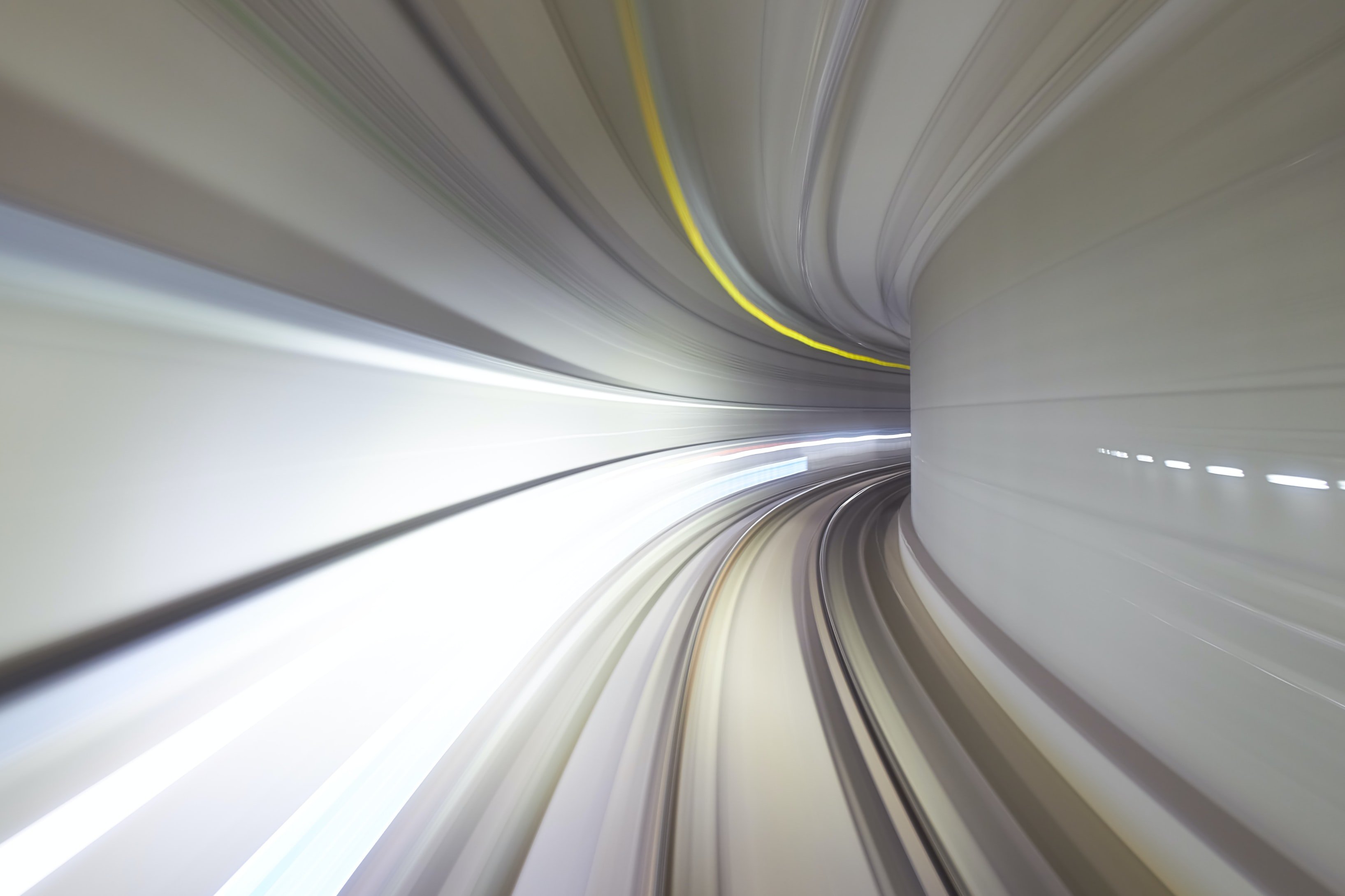 A long exposure of lights showing movement through a tunnel.