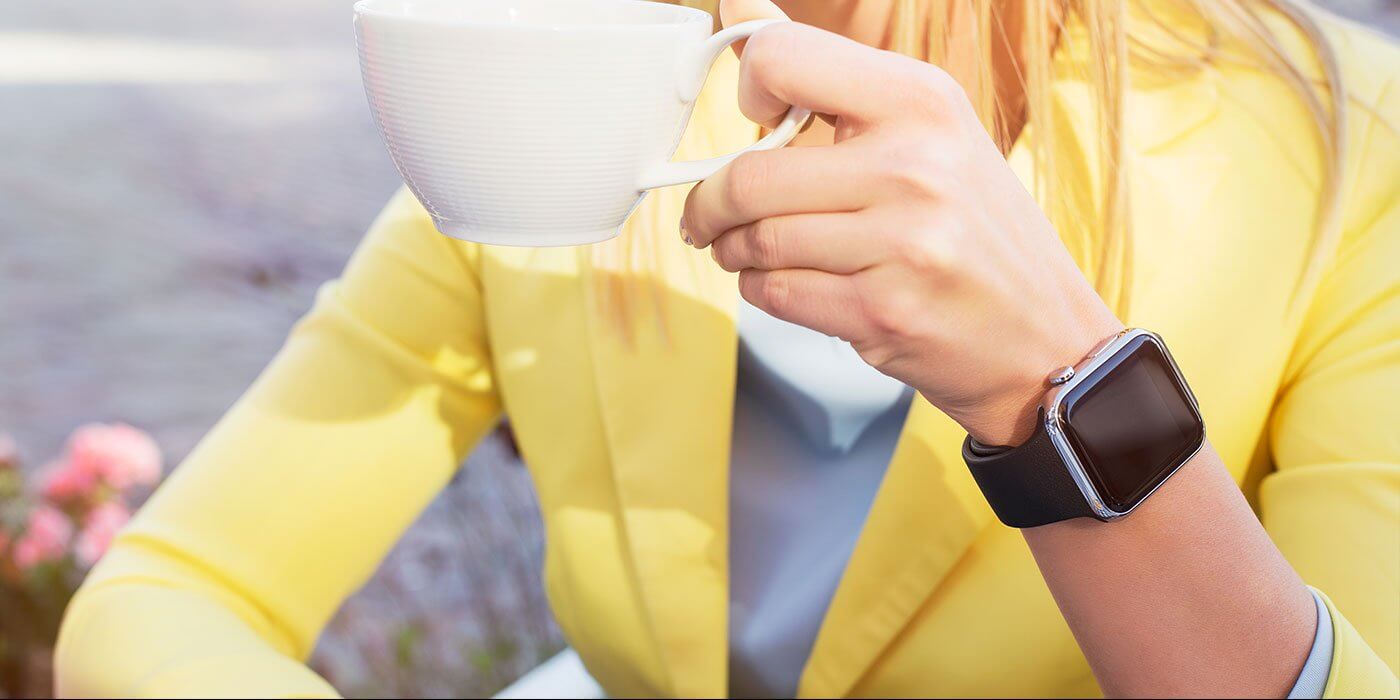 a woman drinking from a mug