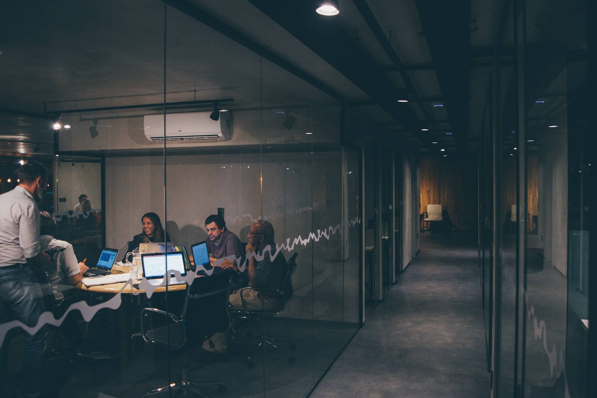 Employees in a conference room during a meeting.