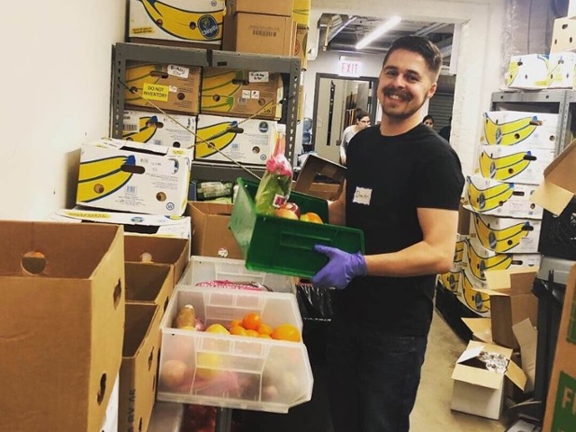 A P/E team member volunteering at the Lakeview Pantry.