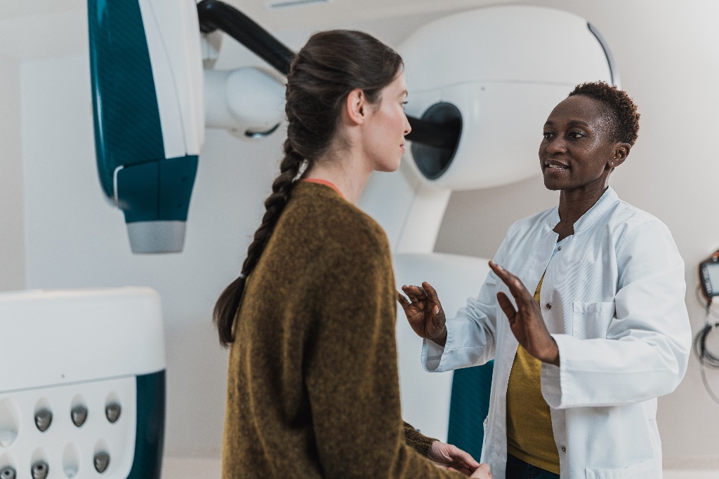 A medical professional talks to a patient.