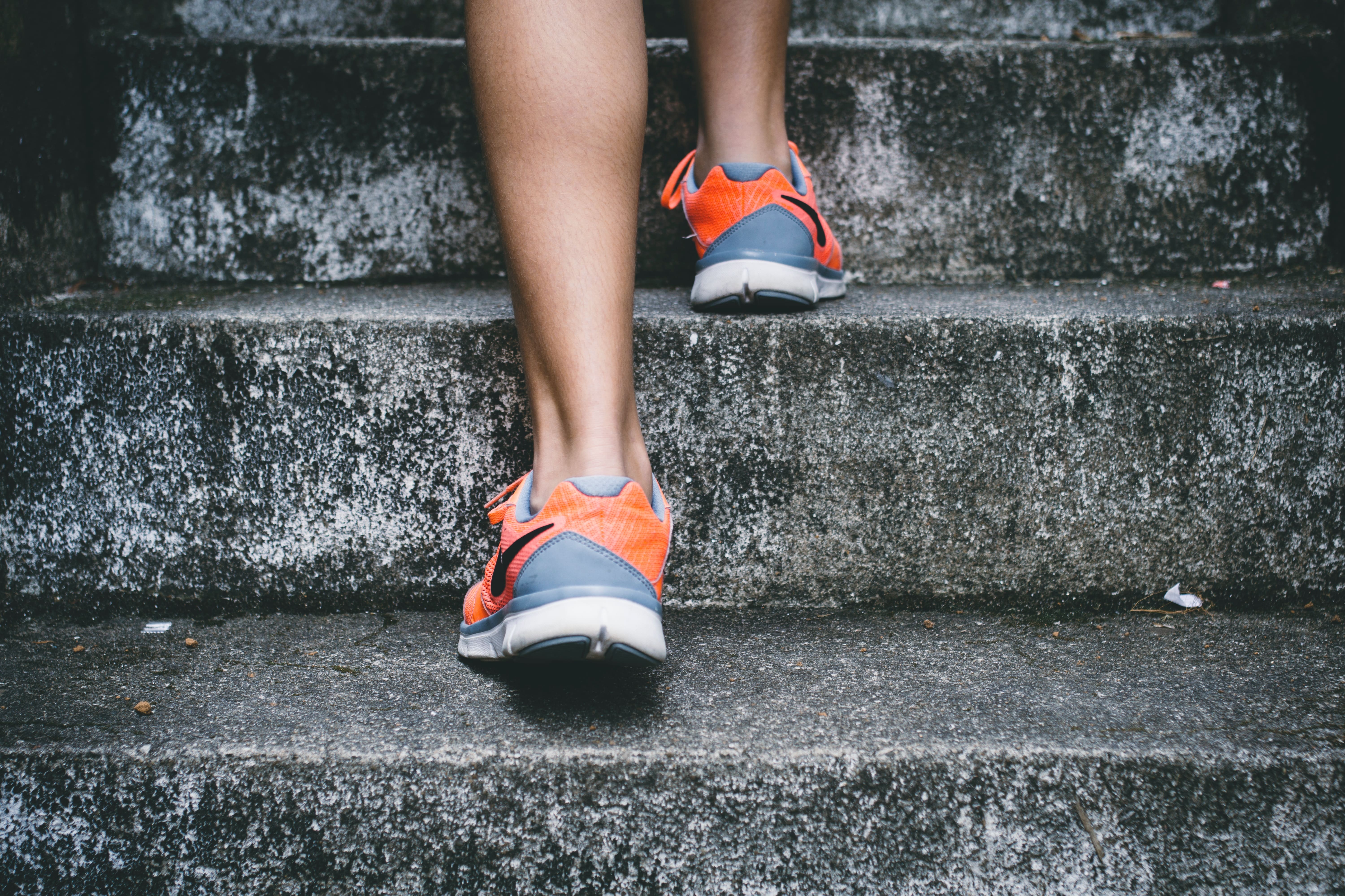 woman running up steps