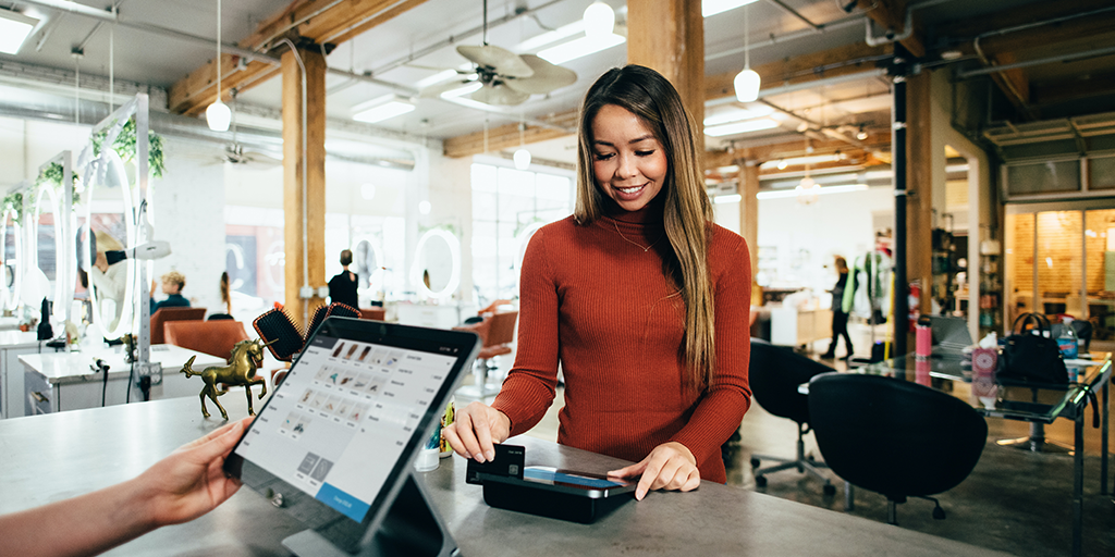 woman paying with credit card