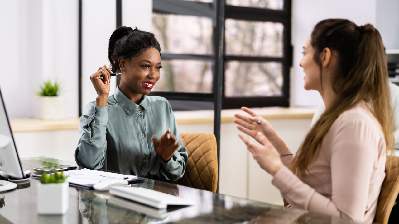 black female talking to a white young female