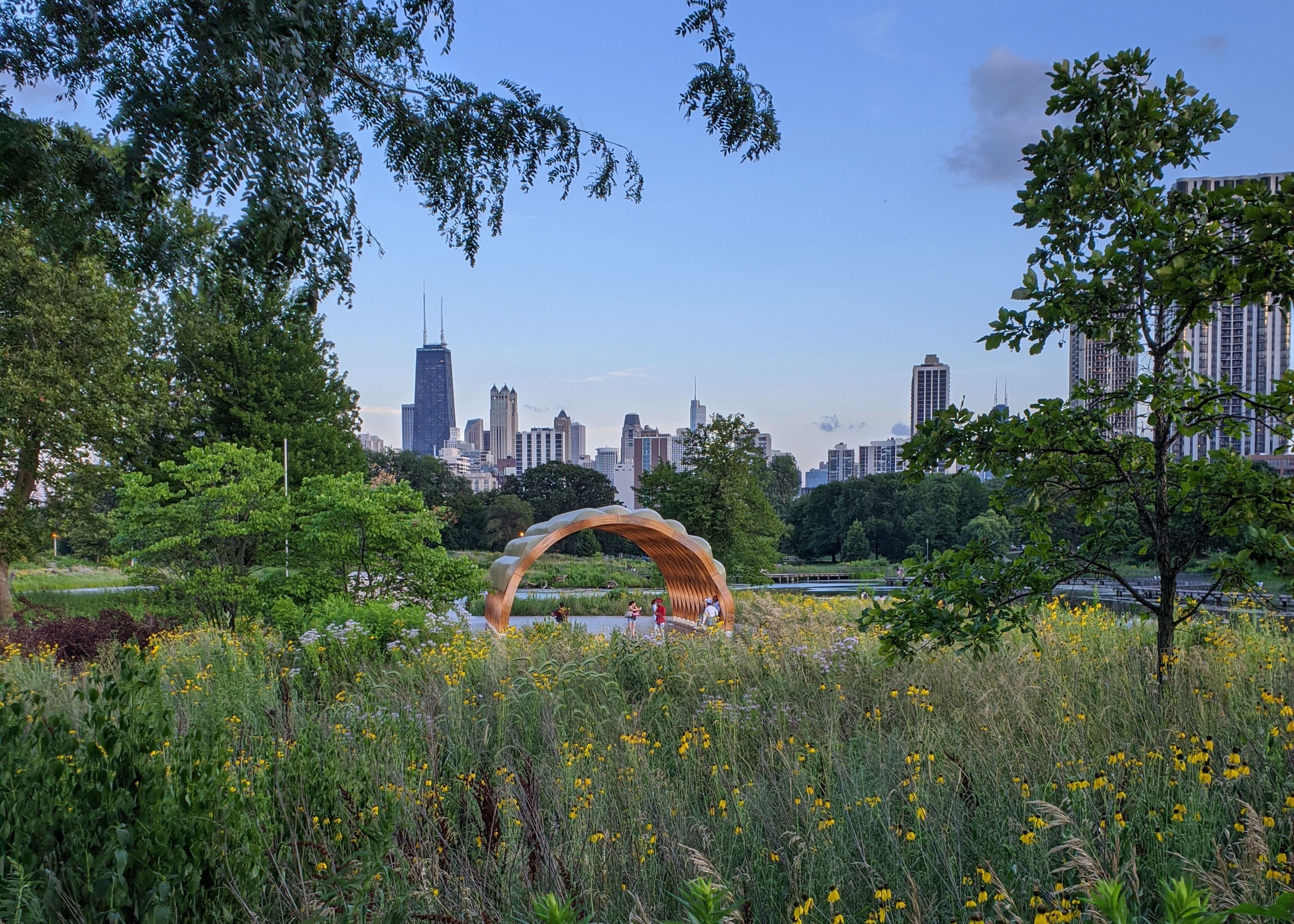 A view of the Chicago skyline behind a beautiful park in Lincoln Park.