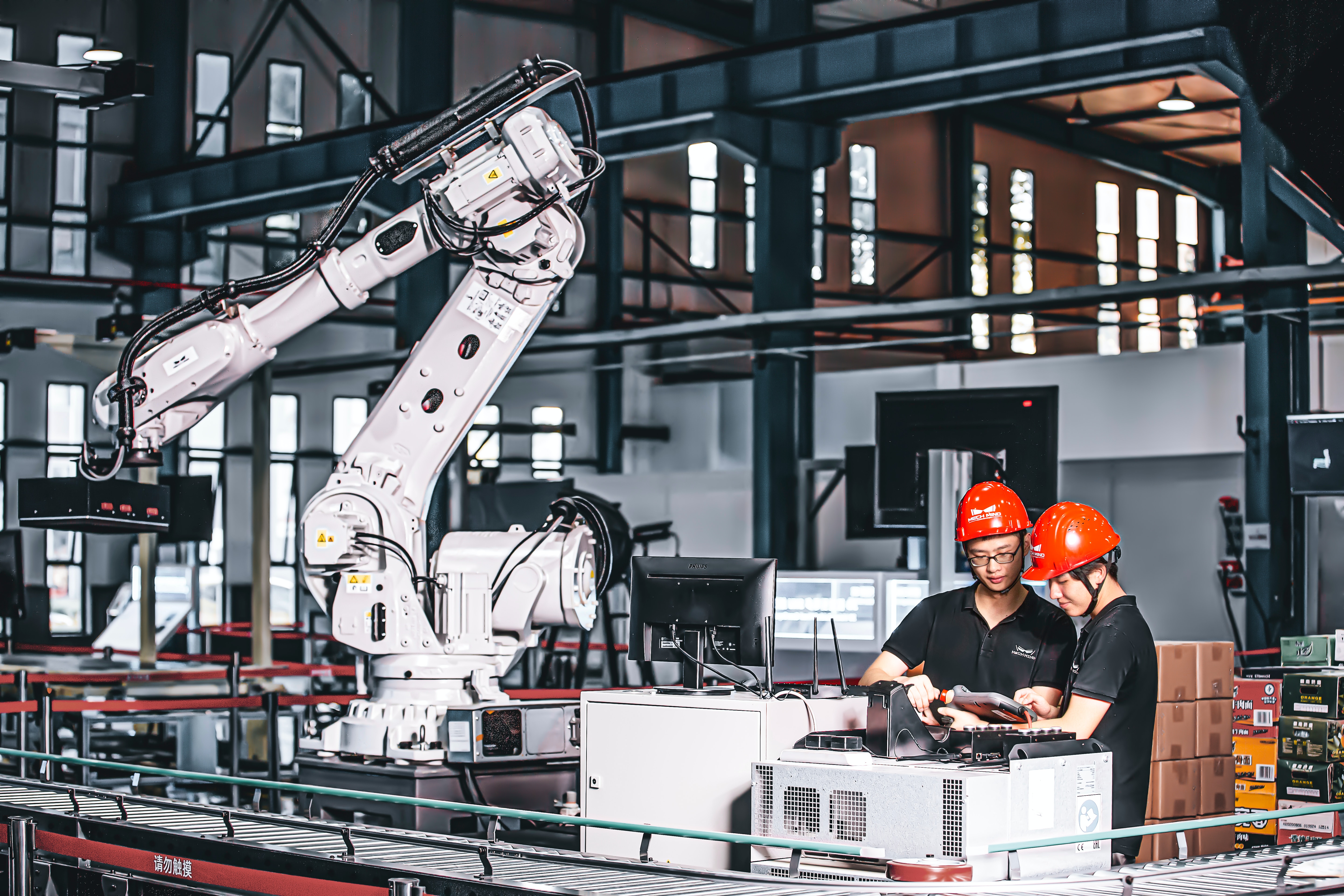 two workers working in an assembly line