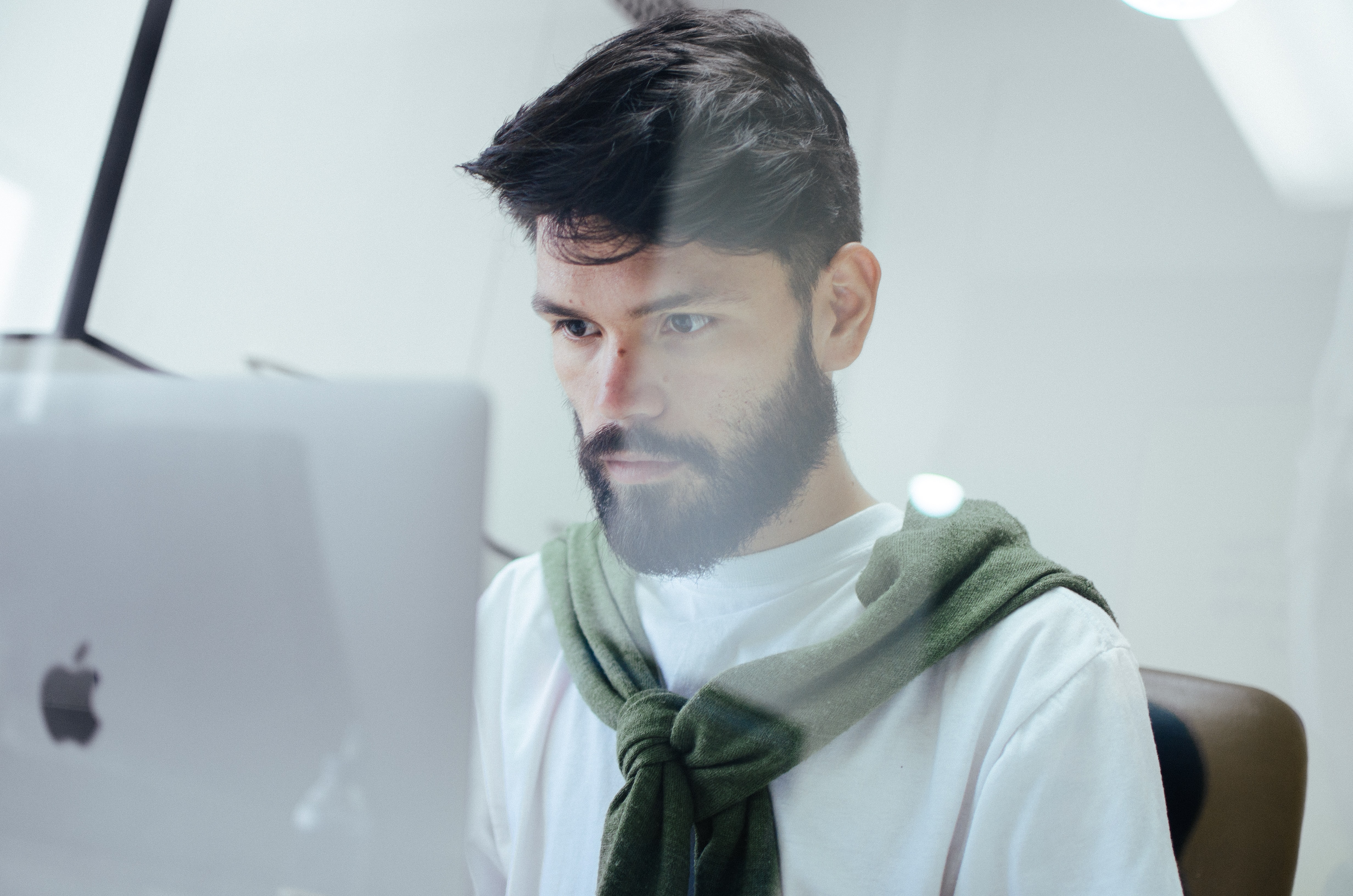 man looking at a computer screen