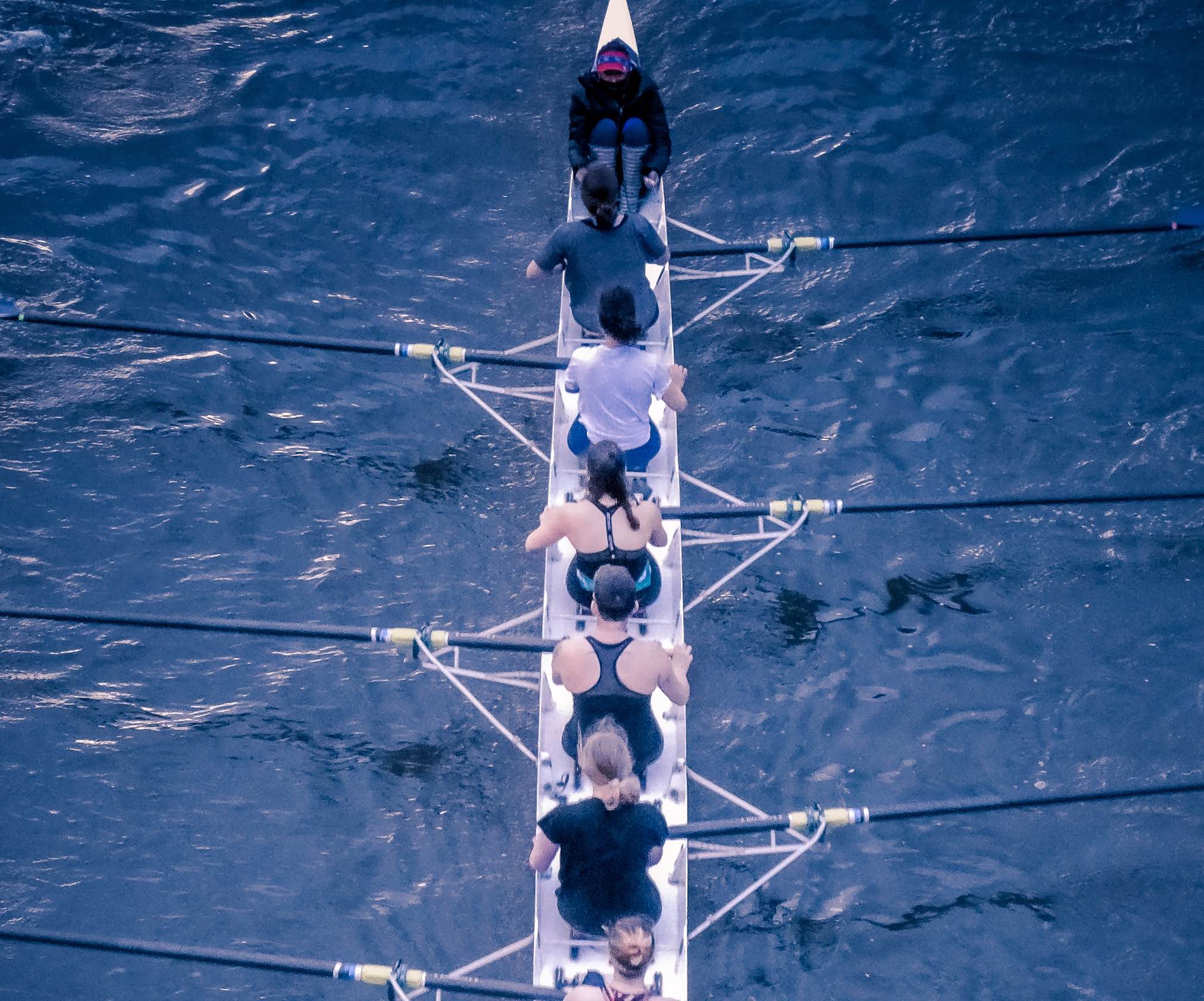 Group of rowers in boat.